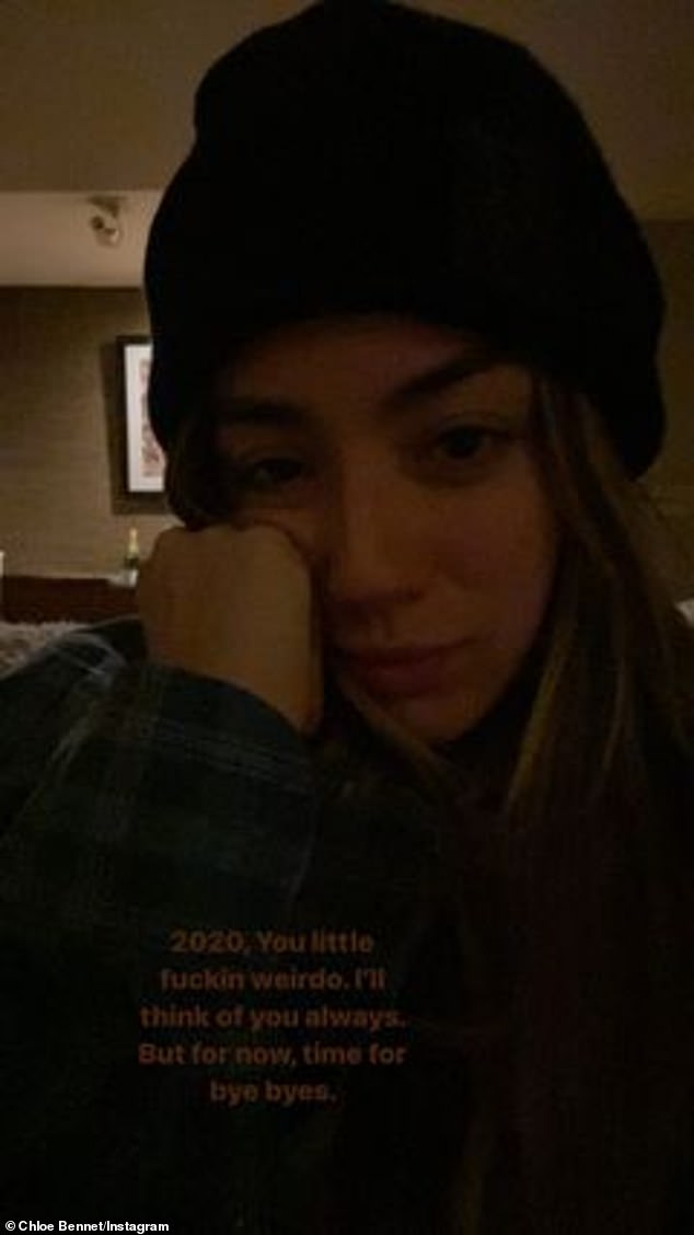 Push through: Additionally, the beauty also took part in a photo shoot of herself in a beanie and looking tired as she pressed one hand to her cheek and described 2020 as a `` A little bit cranky?