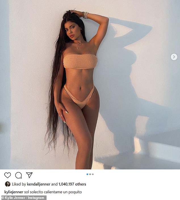 Just another Tuesday night: Kylie turned up the temperature on her Instagram account, when she posted three physical selfies in a super-soft peachy bikini after arriving at her destination
