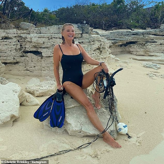 Stunning: The 66-year-old model donned her youthful look in a simple black swimsuit to snap adorable Instagram photos