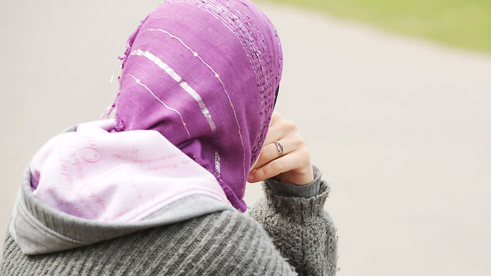 Turkey condemns headscarf ban - opinion