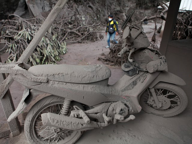 Motorcycle covered in ash in Java.