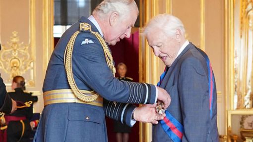 Sir David Attenborough (right) was appointed Knight Grand Cross of the Order of St Michael and St George by Prince Charles.  Photo: Jonathan Brady/PA/AP/dpa