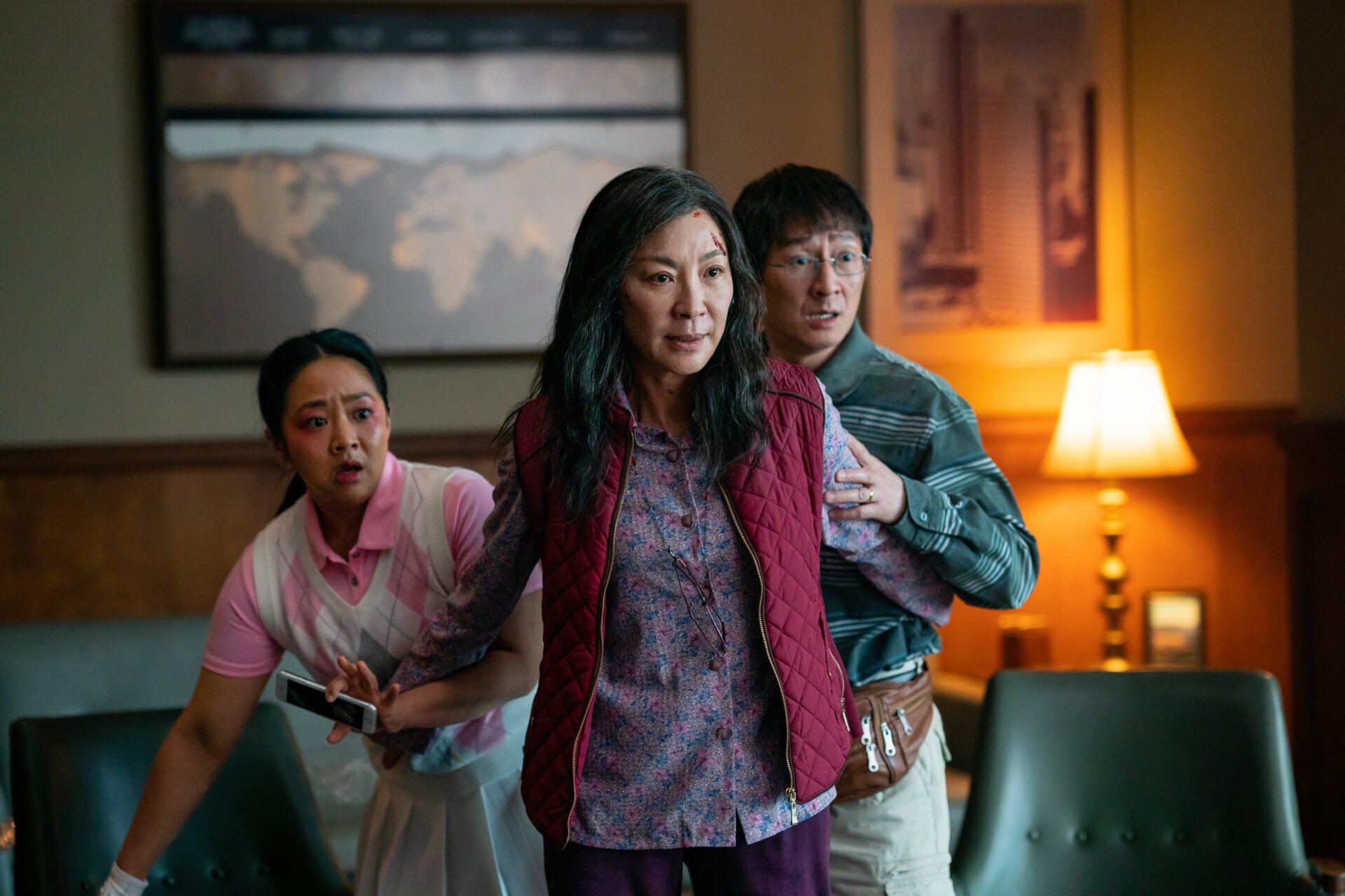 Evelyn (Michael Joh, center) uses her new powers to protect those around her
