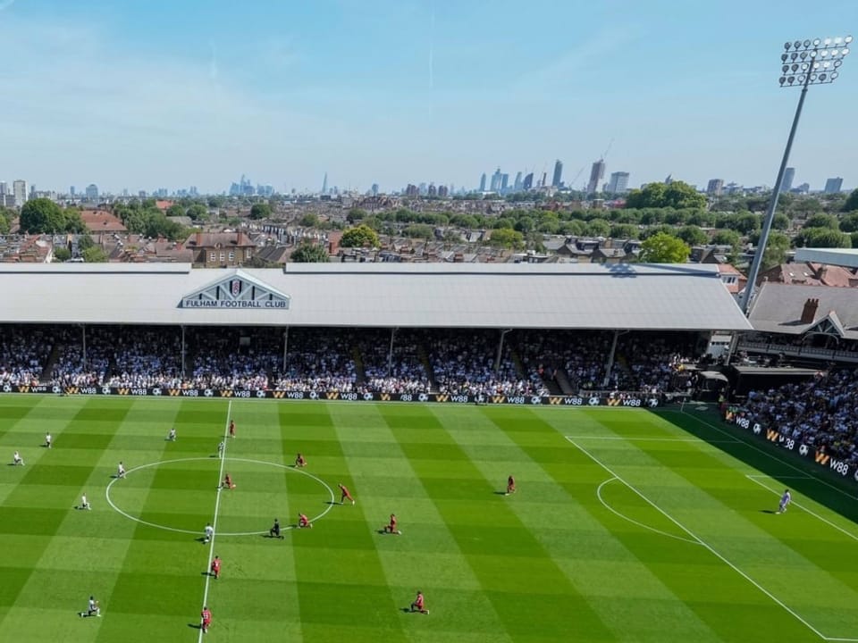 Fulham Stadium and the London skyline in the background