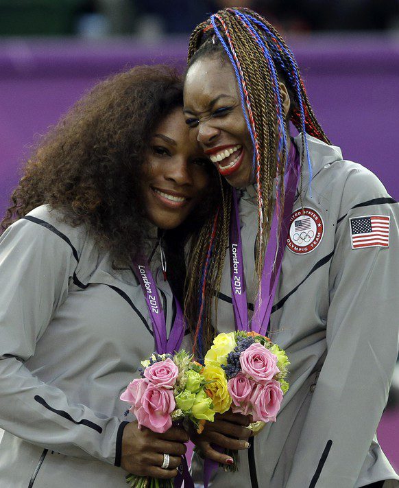 Serena (left) and Venus Williams (right) after winning the Olympic gold medal in doubles in London 2012.