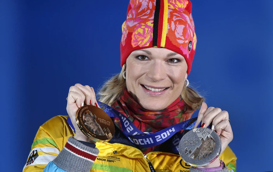 Maria Hofl-Resch presents her medals at the Olympic Games in Sochi.