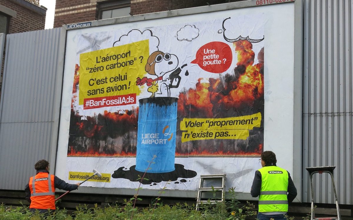 JC Décaux removes a satirical poster in Liege, Belgium.  (Photo: brandalism.ch)