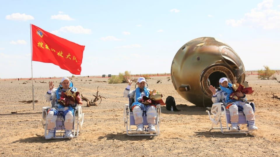 Three astronauts after landing in Mongolia in September 2021. 