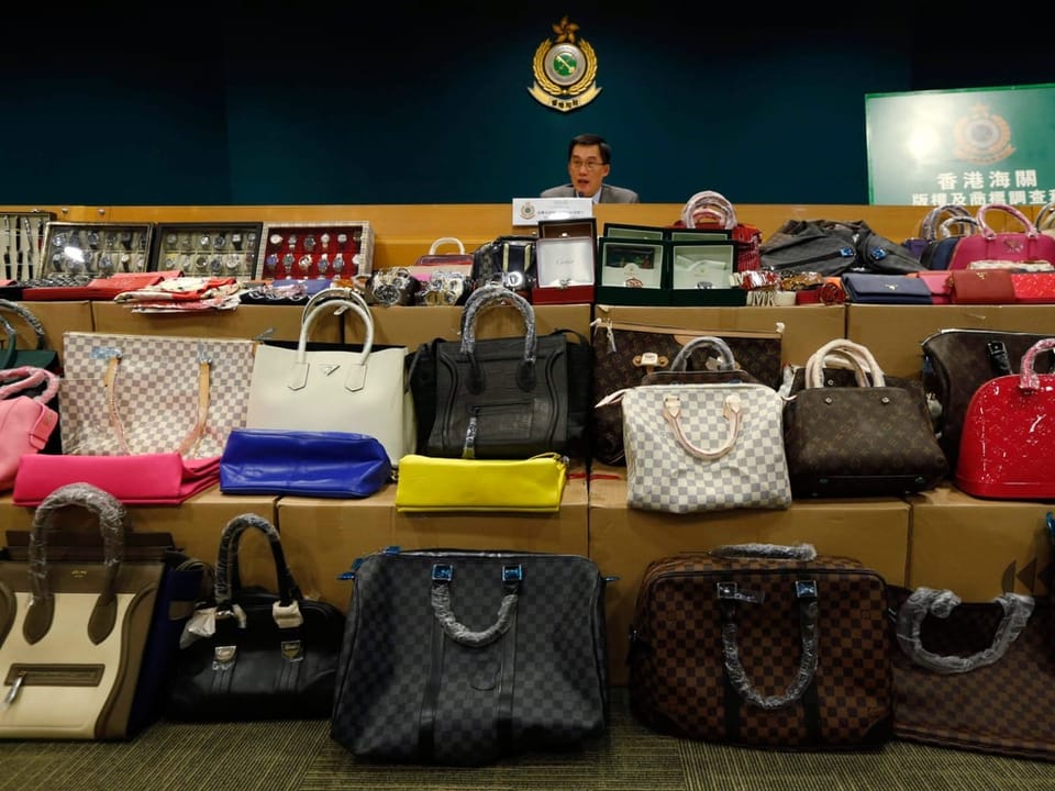 Handbags lined up next to each other